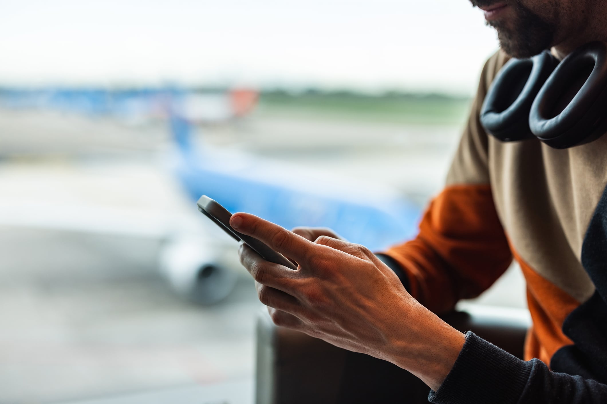 Man Using Phone At Airport