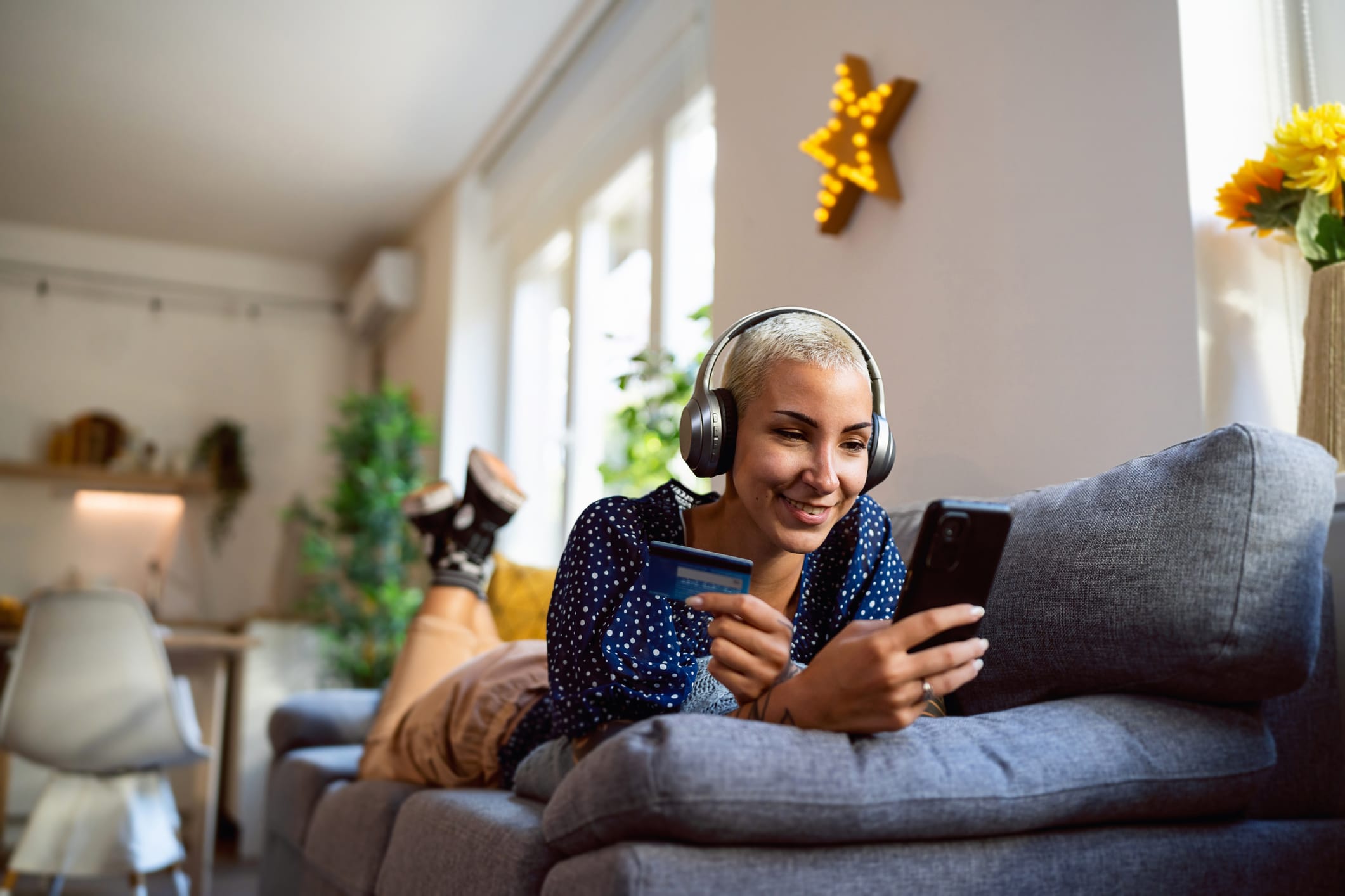 Young Woman Shopping Online From Her Home