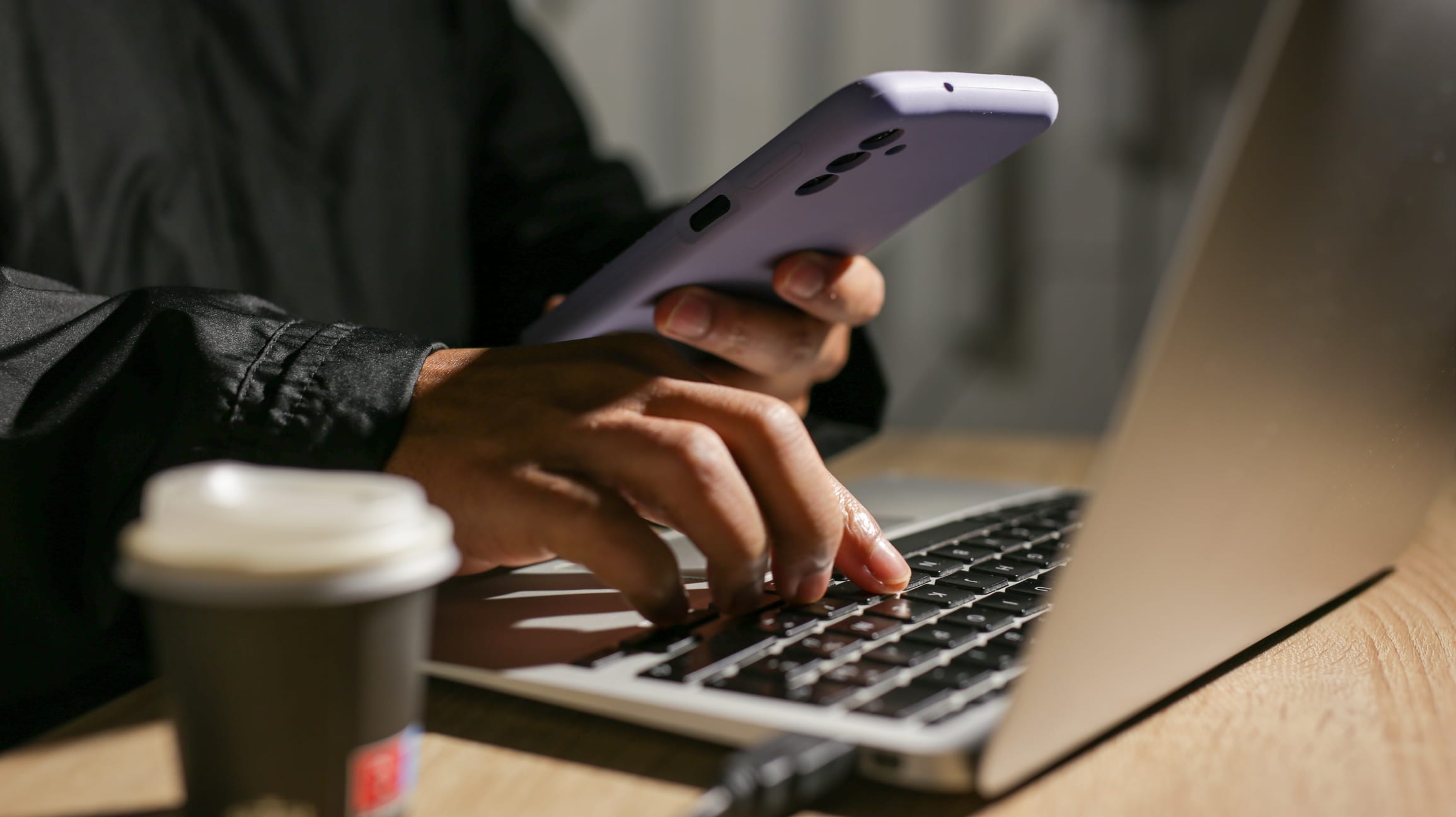 Programmer Using Laptop And Smartphone Is Working On Secure Internet Access